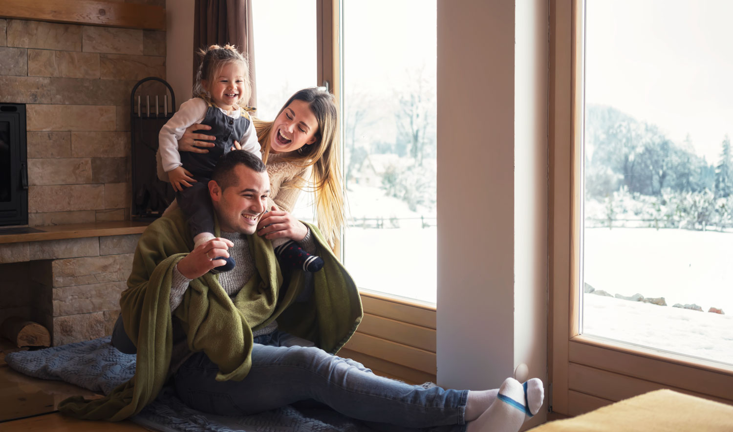Family staying warm in the house during the winter because they had a new furnace installed